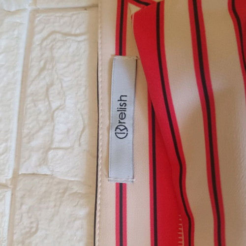 Relish skirt size 42 like new, orange with decorative zippers
