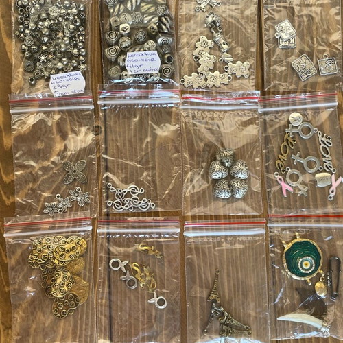 Metal beads and symbols pack like new, 12 bags