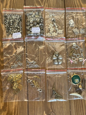 Metal beads and symbols pack like new, 12 bags