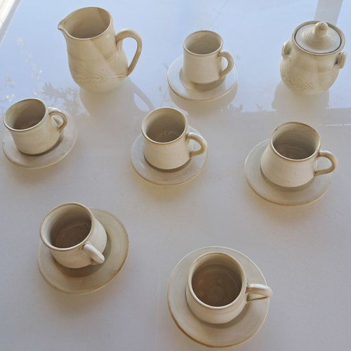 Porcelain coffee cup set with saucers, milk jug and sugar bowl