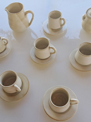 Porcelain coffee cup set with saucers, milk jug and sugar bowl