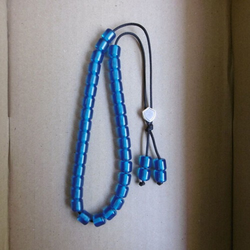 Handmade komboloi with 33+4 blue acrylic beads and silver shield