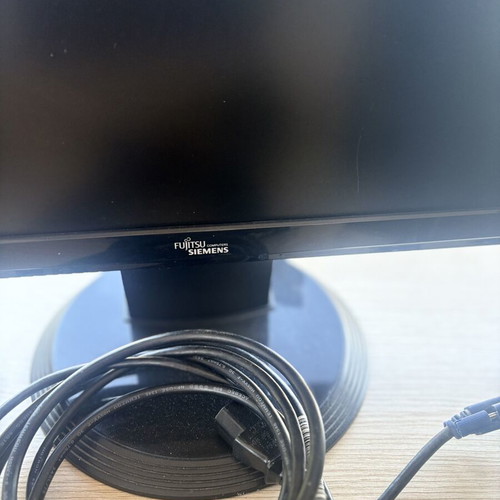Fujitsu-Siemens computer monitor and Logitech speakers with keyboard and webcam
