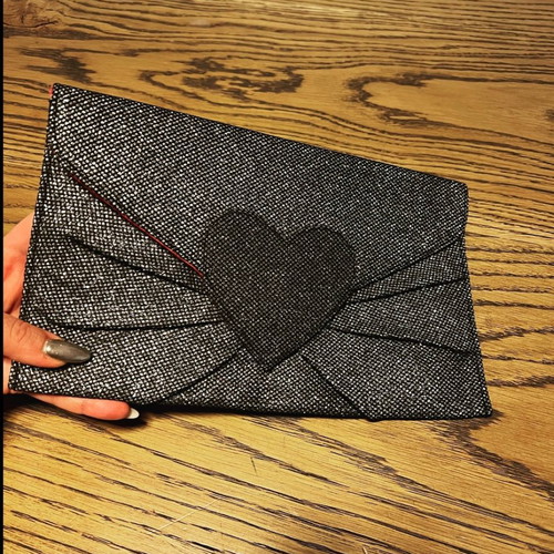 Silver hand bag like new with heart detail