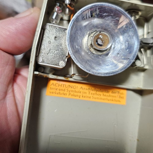 Vintage DDR electrical tool shaped like a flashlight used