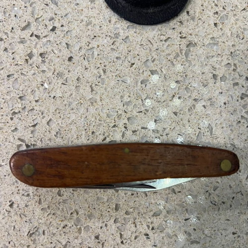 Folding knife used from 1980s with sheath