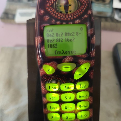 Nokia 3210 vintage cell phone used with new battery and front cover