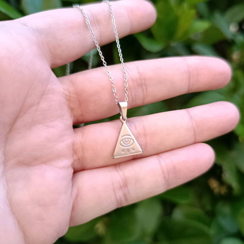 Minimal handmade steel chain necklace with a triangle pendant featuring a carved eye