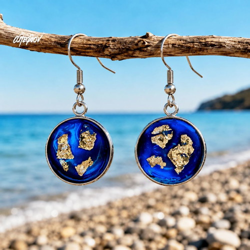 "Aegean Depths" blue and silver earrings with enamel and aluminum foil, Apefthon