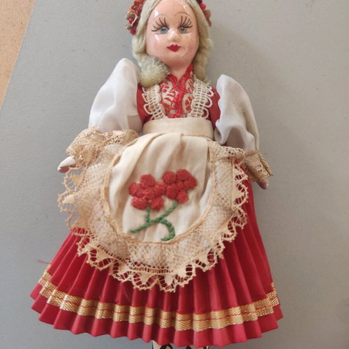 Vintage doll used with porcelain head and embroidered apron