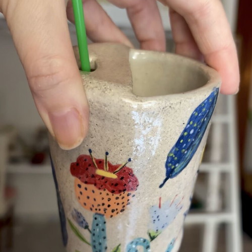Illustrative ceramic mug handmade with floral design