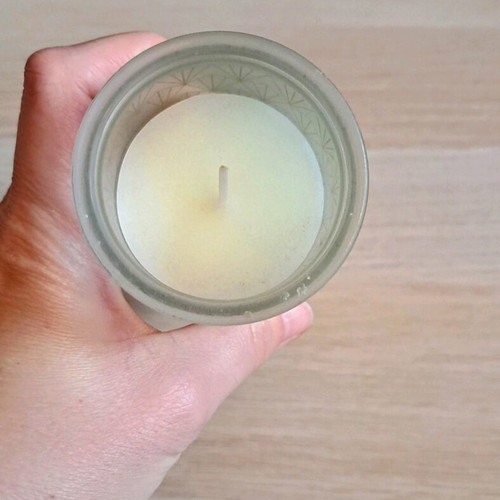 White candle in container new