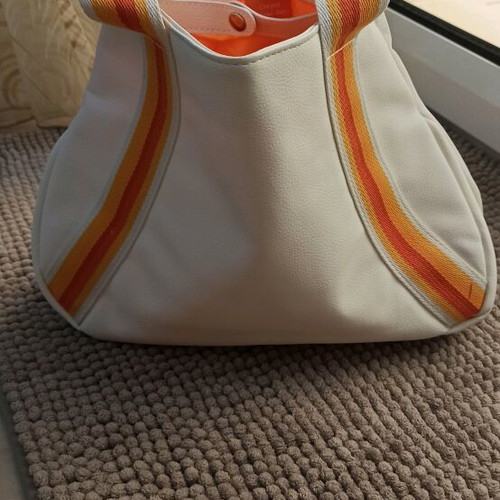 Clarins cosmetic bag new, white with striped handles