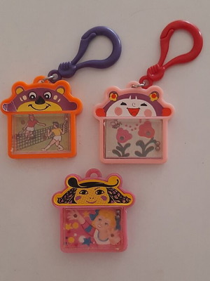 Vintage '80s games keychains with marbles like new