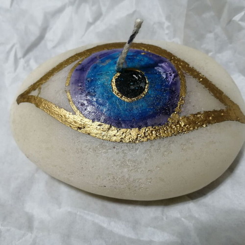Candle in pebble shape with painted eye new