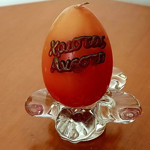 Easter decorative egg-shaped candle like new with glass base