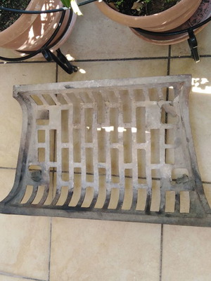 Cast iron fireplace grate slightly used, sturdy