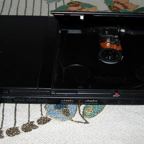 Sony PlayStation 2 Slim SCPH-70004 console bundle with controller and games