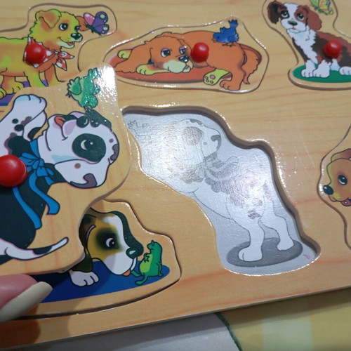 Wooden puzzle with puppies like new