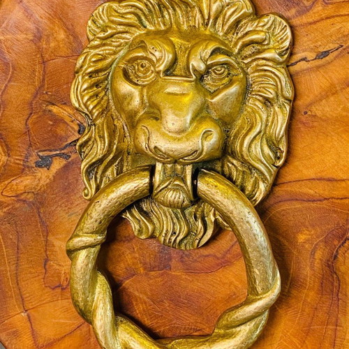 Bronze door knocker used with lion head and wooden base