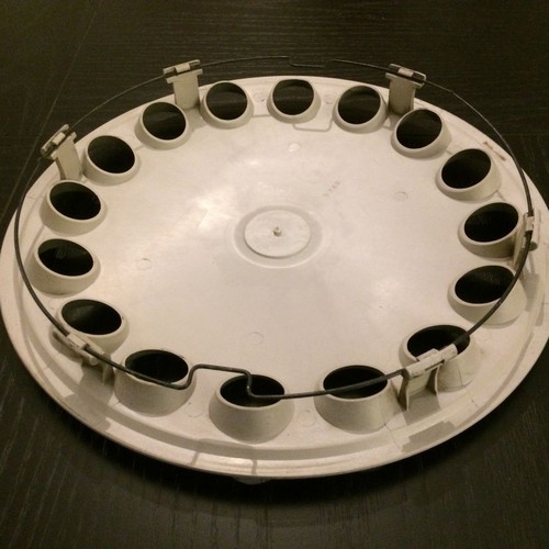 Alfa Romeo 75 hubcap used with scratches and marks