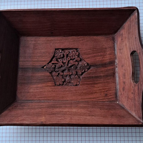 Vintage wooden serving tray used with carved floral motif