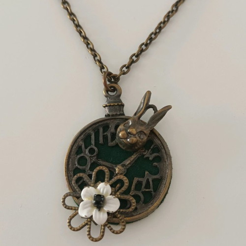 Necklace with rabbit and flower pendant