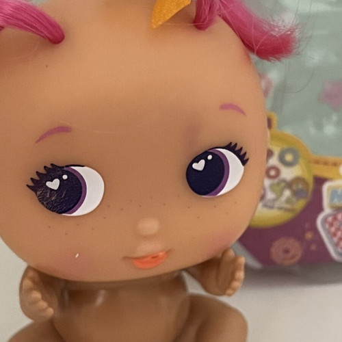 The Bellies Mini Yummy doll used, pink hair, orange bows