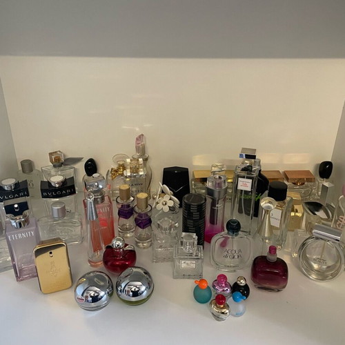 Collection of 44 empty genuine perfume bottles, various brands