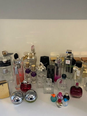 Collection of 44 empty genuine perfume bottles, various brands