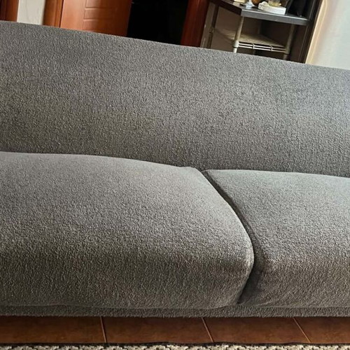 Two-seater sofa gray like new with wooden legs and recliner gift