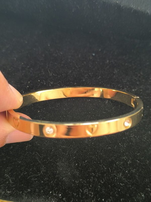 Gold Tone Bangle Bracelet with Hearts and Crystal Details new