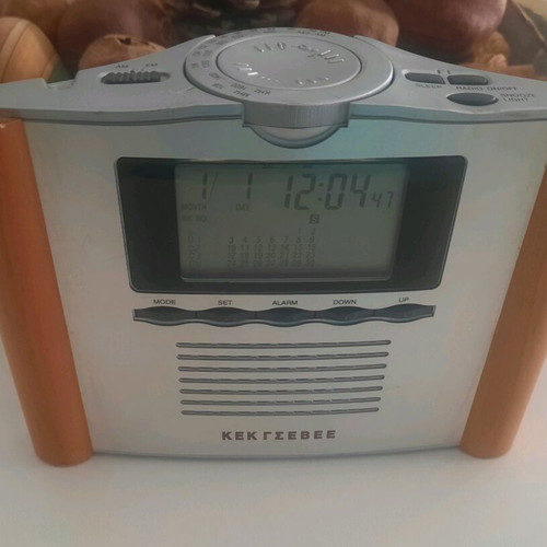 Retro digital tabletop clock with day, month, and year display