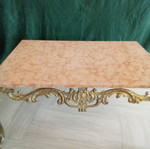 Bronze coffee table used with pink marble