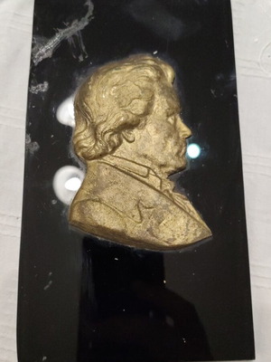 Vintage bronze embossed portrait of Ludwig van Beethoven on black marble used