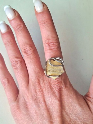 Oltre Mare ring with brass leaf, gold and silver