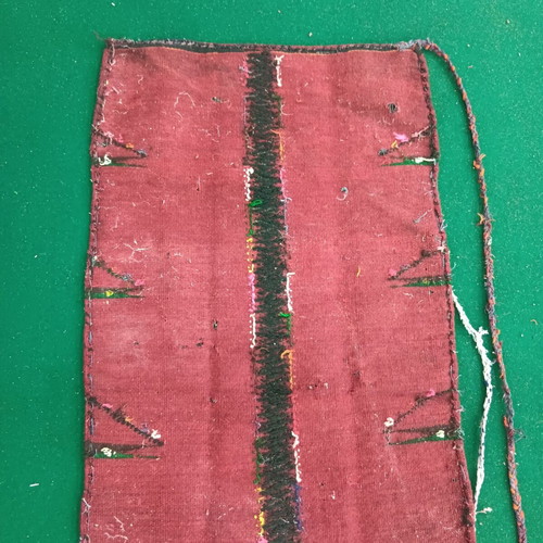 Red striped traditional costume apron used with wear