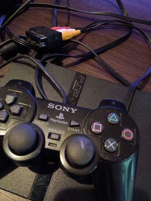 Sony PlayStation 2 console with memory card and remote