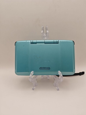 Nintendo DS turquoise handheld console used with charger and stylus