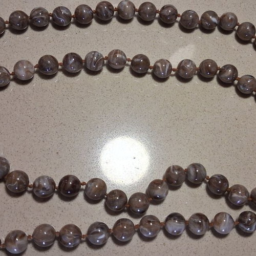 Vintage necklace like new, long with earth tone round beads
