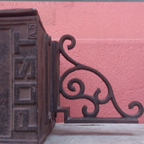 Cast iron mailbox used with metal base for wall or pole mounting