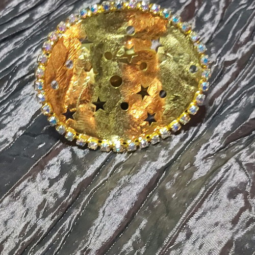Large ring used, gold color with small strass