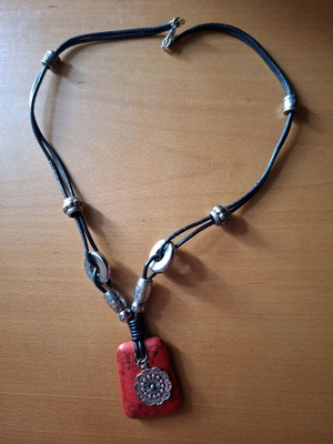 Women's necklace with red stone pendant and silver accessories like new