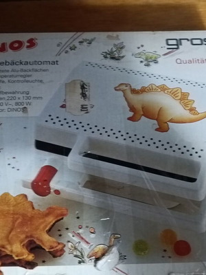 Vintage German waffle maker used with dinosaur design