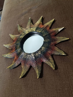 Decorative sun-shaped mirror used