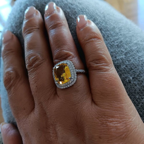 Ring new with large central yellow zircon and white zircons