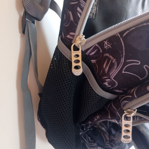 Polo character school backpack with multiple compartments