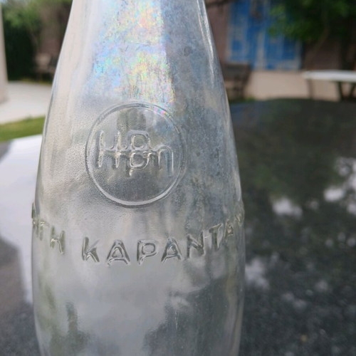 Glass bottle used with embossed HBH Karantani logo
