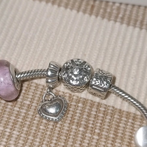 Pandora silver bracelet with 11 charms and collectible clasp, like new