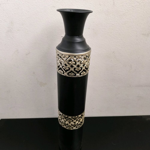 Metal vase in black color with bronze designs like new